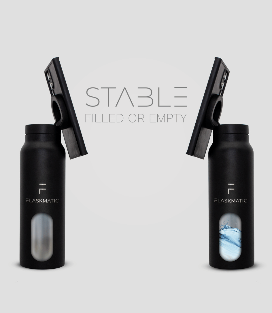 Flaskmatic bottle with a phone securely attached, demonstrating its stable and balanced design. Whether the bottle is full or empty, the phone remains firmly in place, highlighting Flaskmatic’s sturdy construction and reliable stability.